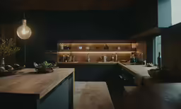 the kitchen is lit up by a dim lamp