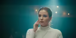 a young woman talks on her cell phone