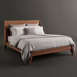 a bed with two pillows on top of it