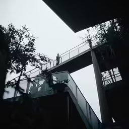 a man standing on top of a walkway