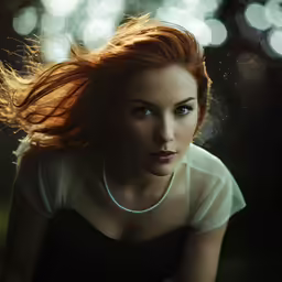 a woman with her hair blowing in the wind
