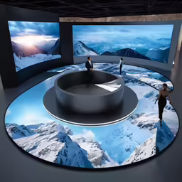 two people standing inside an art exhibit looking at two large screens