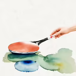 a hand holding a red and black plate with blue discs