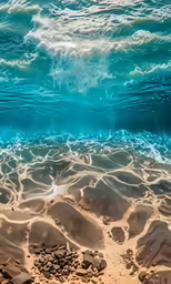 a couple of sand rocks under water