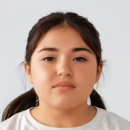a close up of a young woman wearing earrings