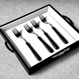 an open box contains five forks and four knives