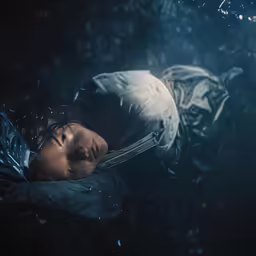 a woman with a surgical mask on is submerged in water