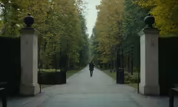 a person that is walking on a pathway