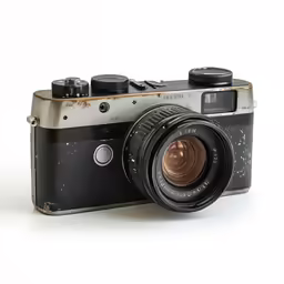 a silver and black camera on white background
