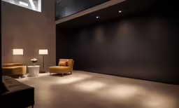 there is a sofa that sits next to the chairs