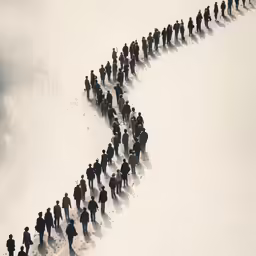 many people in silhouette on a snowy background