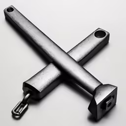a metal object with one screw missing and the other open