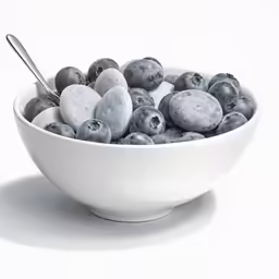 blueberries in a white bowl with a spoon