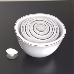 a white bowl on top of a black counter
