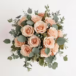 a bouquet of peach flowers on a white background