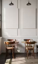 the dining room features wooden chairs, round tables and white paneled walls