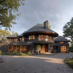 a large home with dark grey siding and windows and large plants