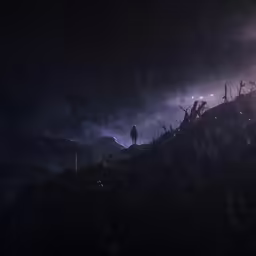 the silhouette of a person standing on a hill, beneath a night sky
