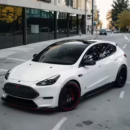 a white car in the middle of a street