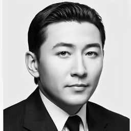 an black and white photo of a man in a suit
