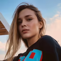 a beautiful blond woman with long hair posing