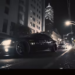 black cars parked along a city street at night