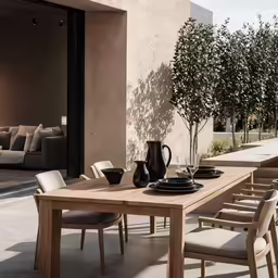 an outdoor dining area in a private house