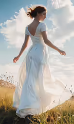 a woman in a white dress is running through a field