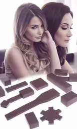 two beautiful women sitting next to each other