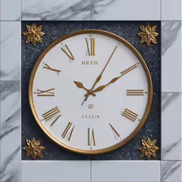 a clock is on the wall outside near marble tiles