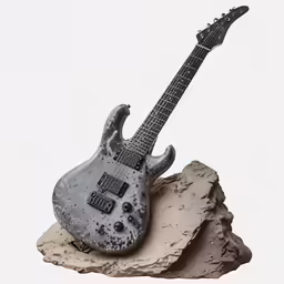 a guitar and rock is shown on a table