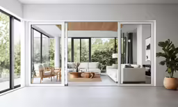there are three white couches that have mirrors