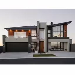 modern, large house with multiple windows and garage