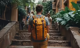 a man with a back pack is going up some stairs