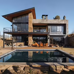 an image of a house with an outside swimming pool