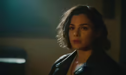 a beautiful woman wearing a leather jacket