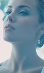 a close up of a woman wearing jewelry