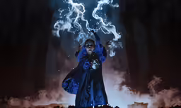 a woman in blue with her hands raised and lit lightning coming from her back