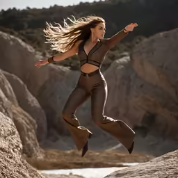 a woman is jumping on a rock in the water