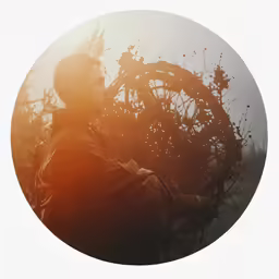 there is a man carrying a circular object