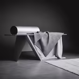 an umbrella sitting on top of a wooden bench