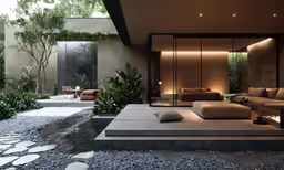 a living room with glass doors leading to a courtyard