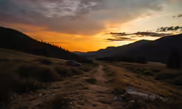a view of the sunset on an open land
