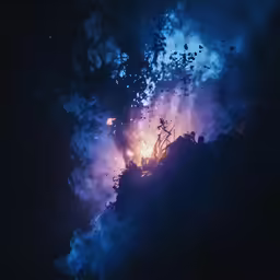 a large cloud filled with lots of dark blue smoke