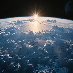 a view of the sun shining through the clouds