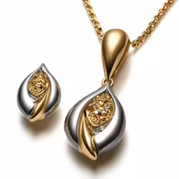 a pair of gold and silver jewelry on a white background