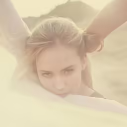 a close up of a woman wearing a scarf