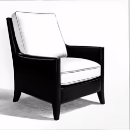 a black chair and some white sheets on a wall