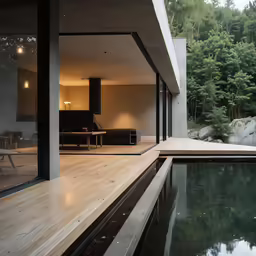 an empty patio near a large swimming pool