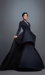 a model in black and blue gown